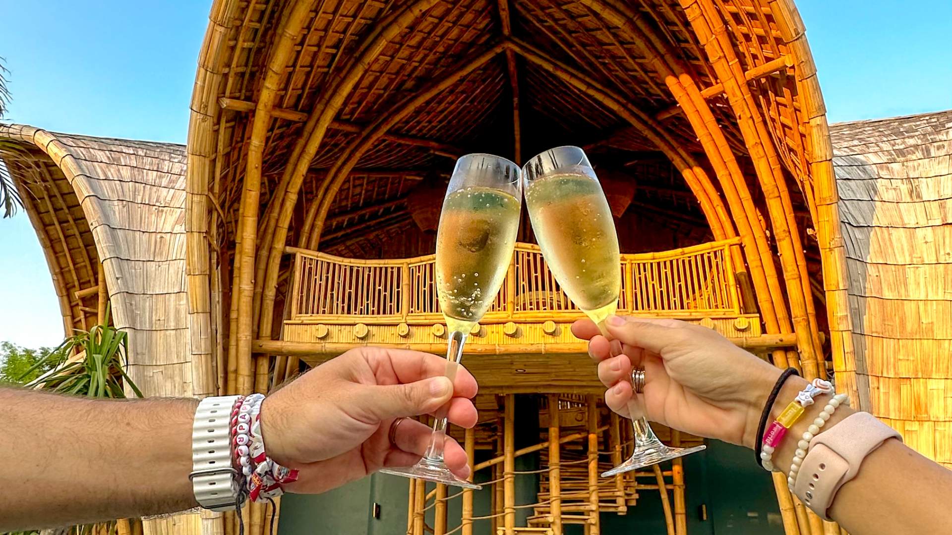 A couple enjoying a champagne in their villas